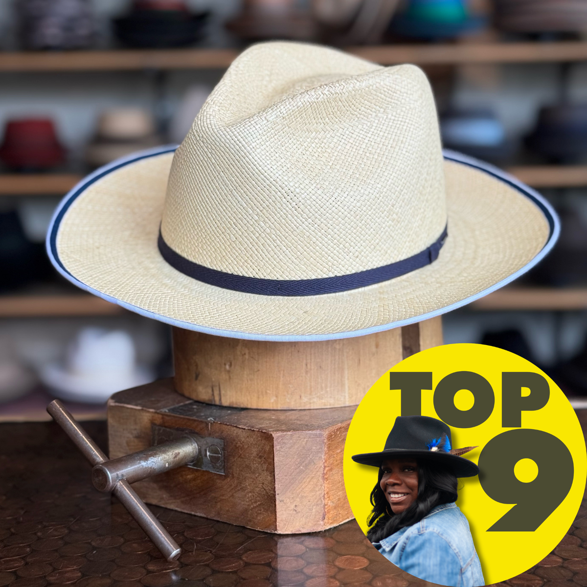 Parson natural straw hat with a black band and thin brim edge, displayed on a wooden stand, showcasing a classic style of brim hats.