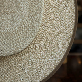 Close-up of the woven straw texture and edge detailing on the Canero Bolero hat, showcasing its natural color and craftsmanship.
