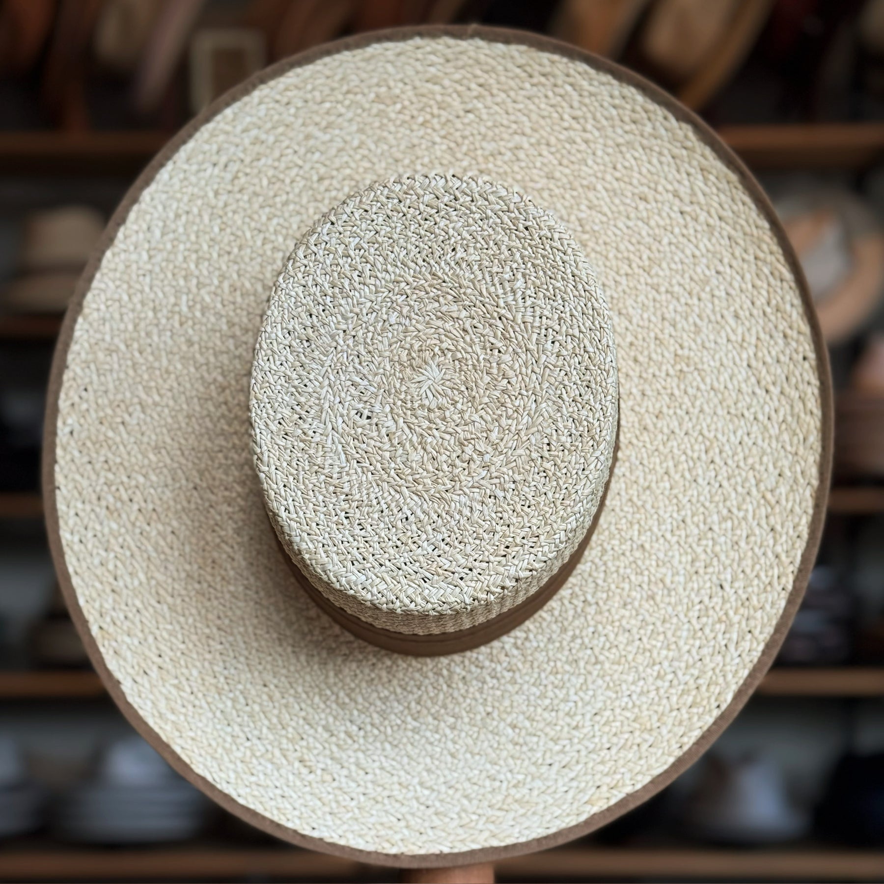 Canero Bolero wide-brimmed straw hat with natural woven texture and subtle brown trim, ideal for stylish sun protection and classic accessory looks.