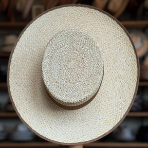 Canero Bolero wide-brimmed straw hat with natural woven texture and subtle brown trim, ideal for stylish sun protection and classic accessory looks.