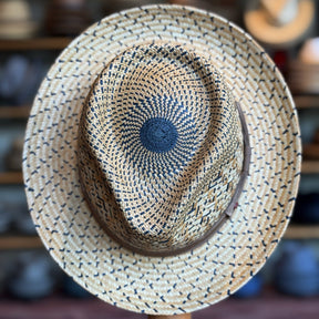 Top of Maize Panama Fedora crafted from braided straw with a natural beige and black  pattern, featuring a structured crown and wide brim, ideal for stylish sun protection.