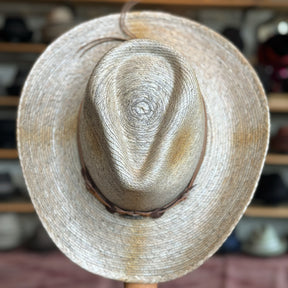 Monterrey Bay straw hat with a wide brim and a woven leather band, ideal for sun protection and stylish outdoor wear.