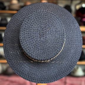 Noreen black woven wide brim hat with a rounded crown, showcasing a textured pattern suitable for stylish sun protection and casual wear.